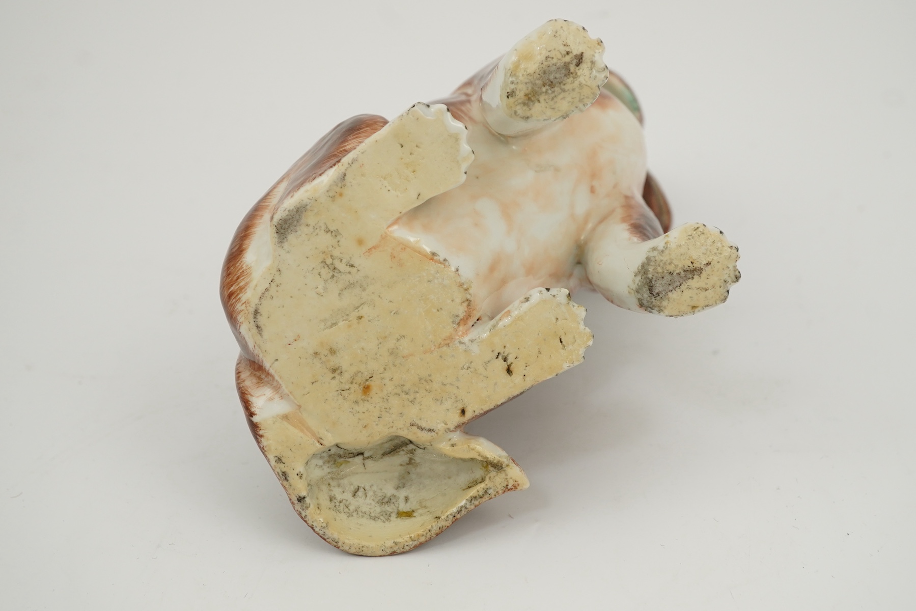 A Chinese export enamelled porcelain model of a seated spaniel, Qianlong period